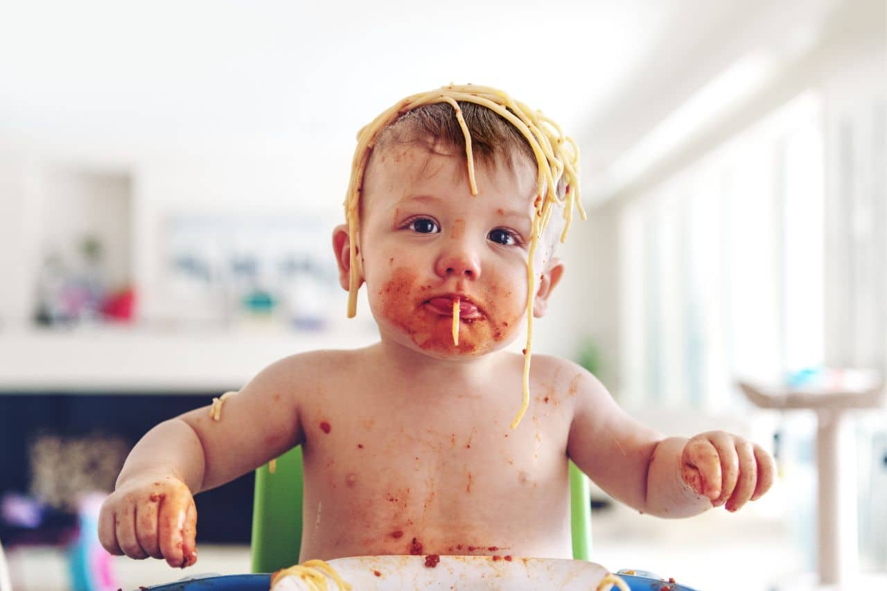 Food before one is just for fun myth-baby getting messy while eating